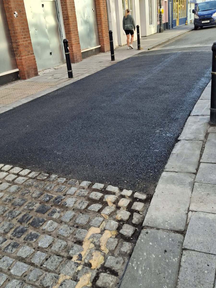 Half-a job-Bob Asks Devizes, “Anyways, How Do You Like Your New Yard of Resurfaced&nbsp;Road?!”