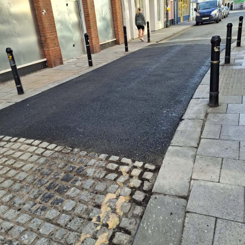 Half-a job-Bob Asks Devizes, “Anyways, How Do You Like Your New Yard of Resurfaced&nbsp;Road?!”